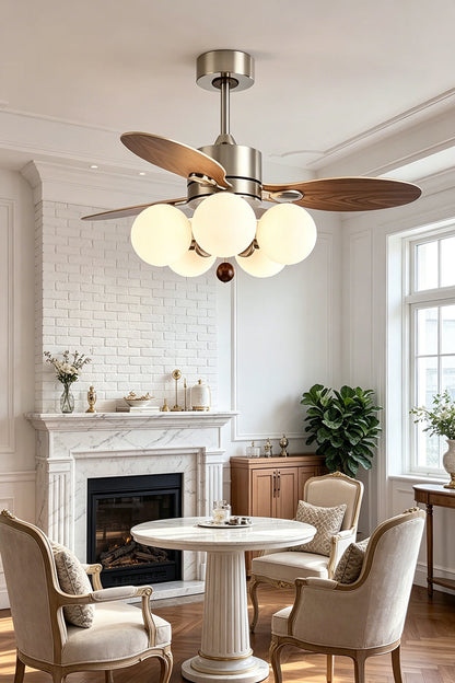 Keller Wooden Ceiling Fan Light | Wood, Glass, Metal | Staged in a cozy lounge room corner near a white fireplace, radiating warm light over traditional armchairs | vexa lamps