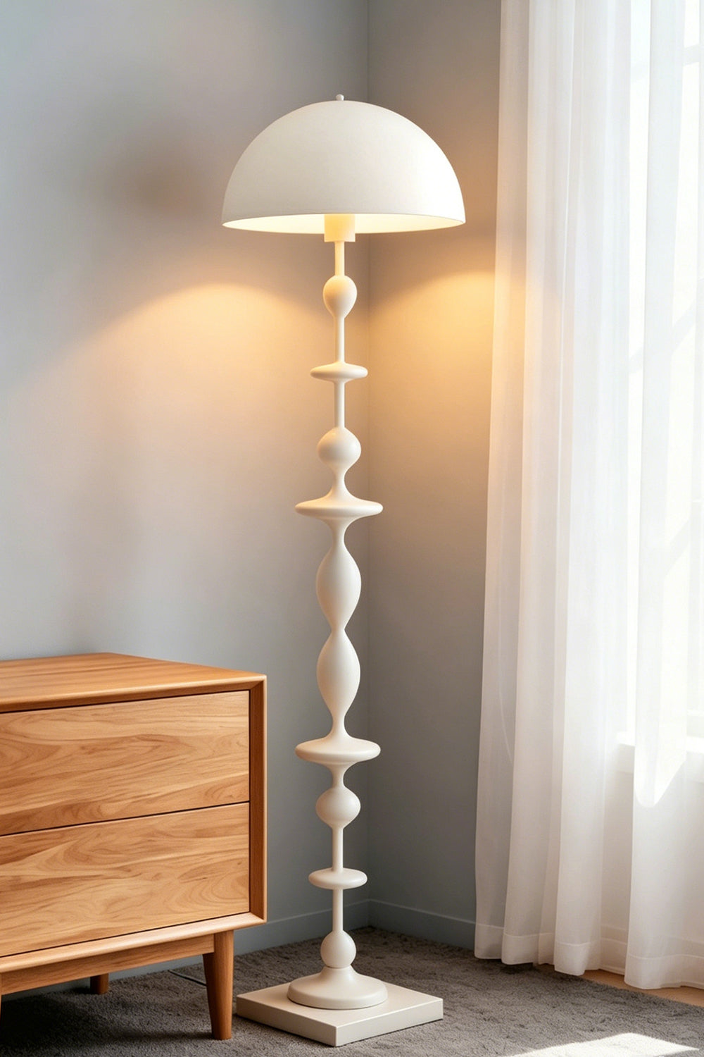 Kira Beaded Mushroom Floor Lamp | Metal, Glossy Finish | The white variant illuminated in a cozy bedroom corner next to a wooden dresser and sunlit window | vexa lamps