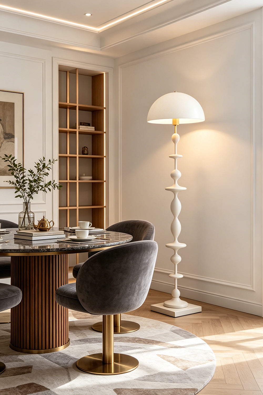 Kira Beaded Mushroom Floor Lamp | Metal, Glossy Finish | The white variant styled elegantly in a dining room corner next to a round wooden table and plush grey chairs | vexa lamps