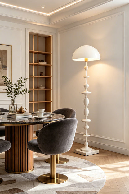 Kira Beaded Mushroom Floor Lamp | Metal, Glossy Finish | The white variant styled elegantly in a dining room corner next to a round wooden table and plush grey chairs | vexa lamps