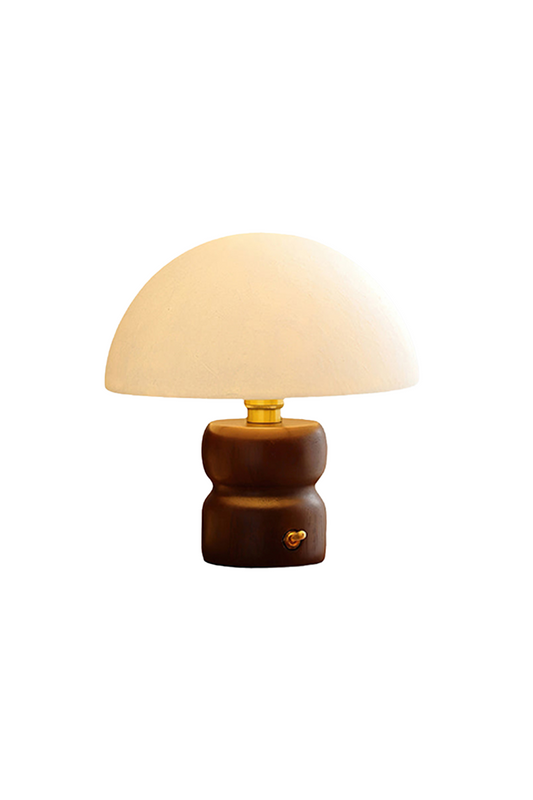 Kira Sculpted Mushroom Table Lamp | Wood, Glass | Minimalist mushroom-shaped table lamp featuring a white textured dome lampshade and a sculpted dark walnut wood hourglass base | Isolated lit product shot on white background | vexa lamps