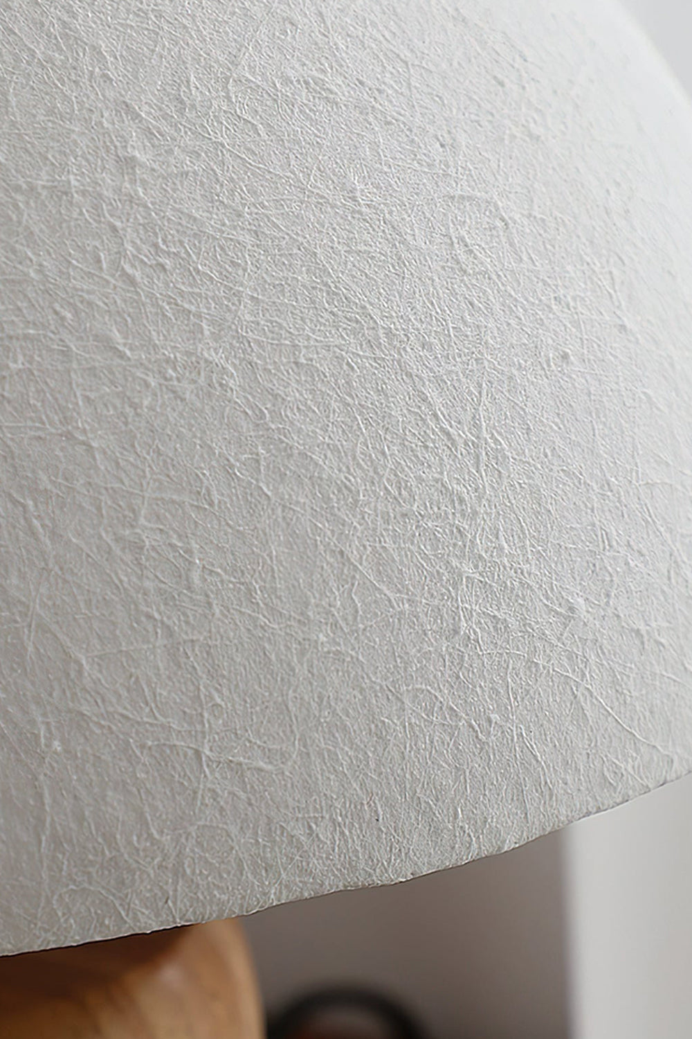 Kira Sculpted Mushroom Table Lamp | Wood, Glass | Macro close-up view highlighting the fine sand-textured stucco finish of the white dome glass lampshade | Detail shot | vexa lamps