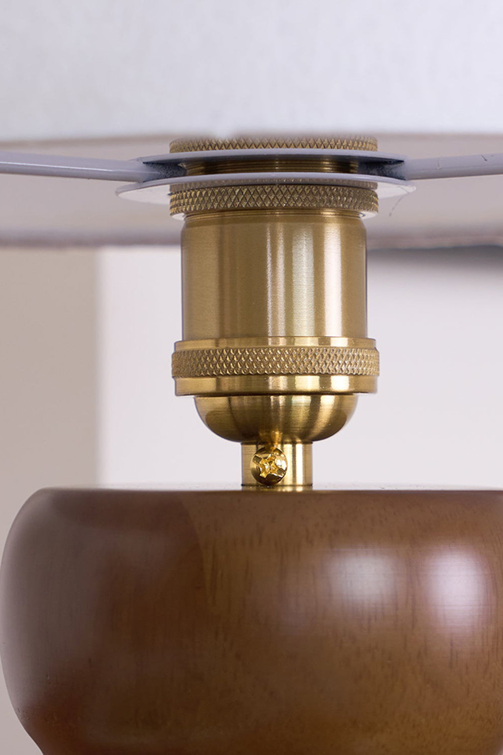 Kira Sculpted Mushroom Table Lamp | Wood, Glass | Internal macro view showcasing the polished gold brass socket neck connector underneath the glass shade structure | Detail shot | vexa lamps