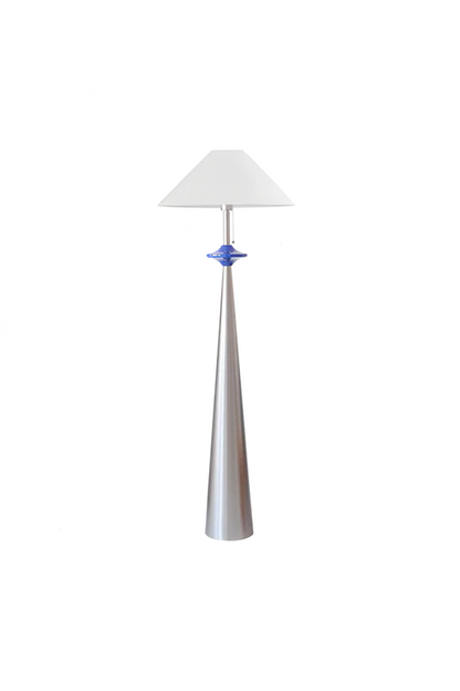 Lazuro Postmodern Cone Floor Light | Metal, Fabric | Isolated unlit view of a postmodern floor lamp featuring a tall tapered silver chrome conical base, a distinctive cobalt blue puck accent, and a white cone shade | White background | vexa lamps