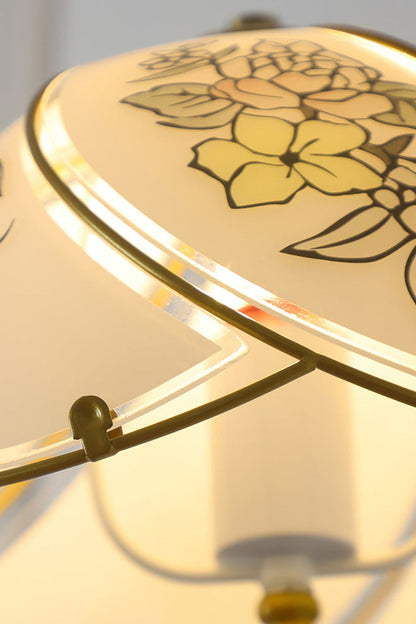 Lillian Retro Floral Pendant Lamp | Glass, Metal | Close-up focus on the illuminated white glass shade highlighting the delicate warm yellow floral painted line details | Detail shot | vexa lamps
