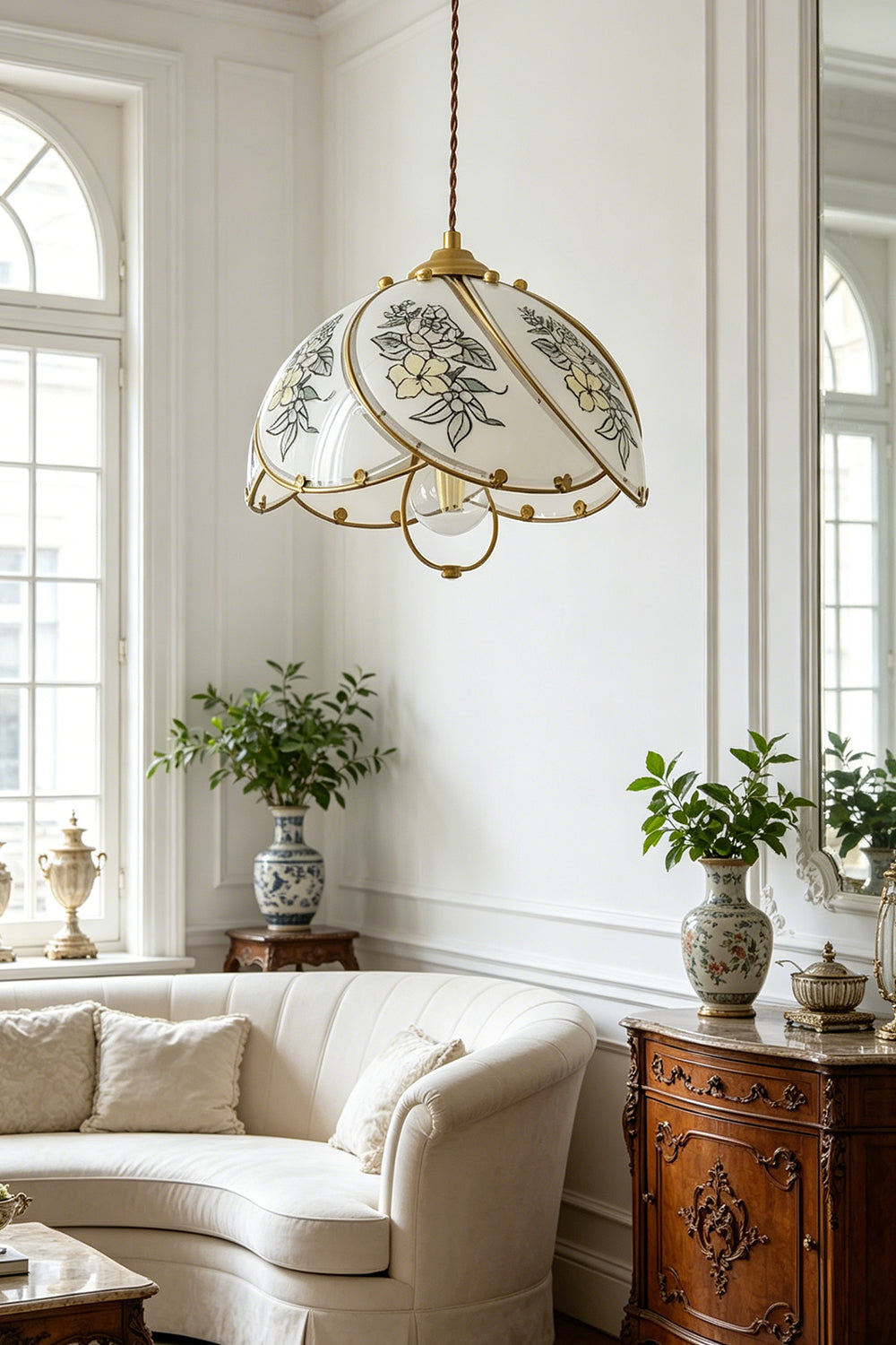 Lillian Retro Floral Pendant Lamp | Glass, Metal | Providing an elegant centerpiece above a curved cream sofa in a sunlit classic living room with arched windows | vexa lamps