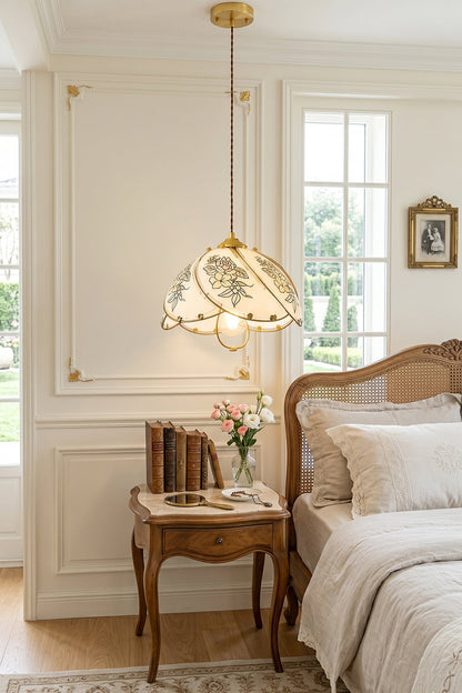 Lillian Retro Floral Pendant Lamp | Glass, Metal | Hanging as an elegant bedside lamp over a classic wooden nightstand in a bright white paneled bedroom | vexa lamps