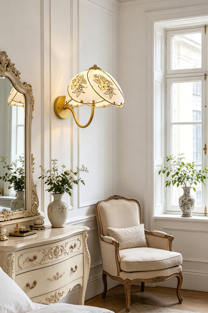 Lillian Retro Floral Wall Lamp | Glass, Metal | Installed next to a classic mirrored vanity table and a French-style armchair in a bright room | vexa lamps
