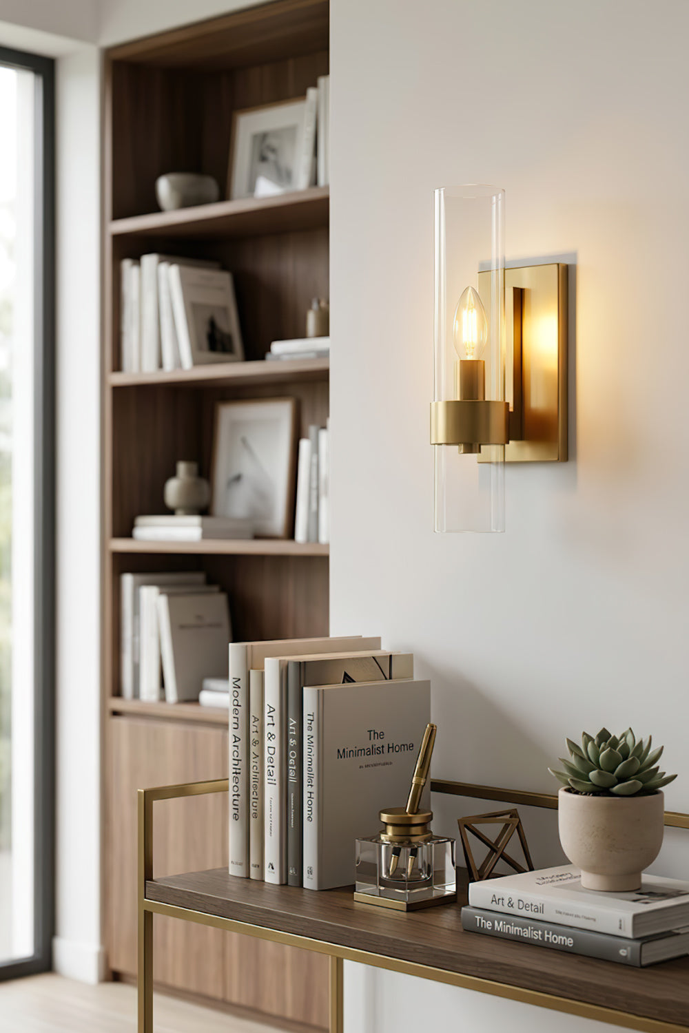 Linear metallic brass sconce | Brass, Glass | Mounted on a wall in a home office with bookshelves | vexa lamps