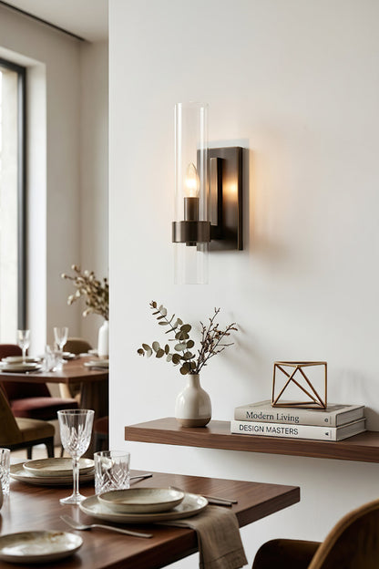 Sleek linear wall sconce in black finish | Brass, Glass | Dining room scene near a wooden table | vexa lamps