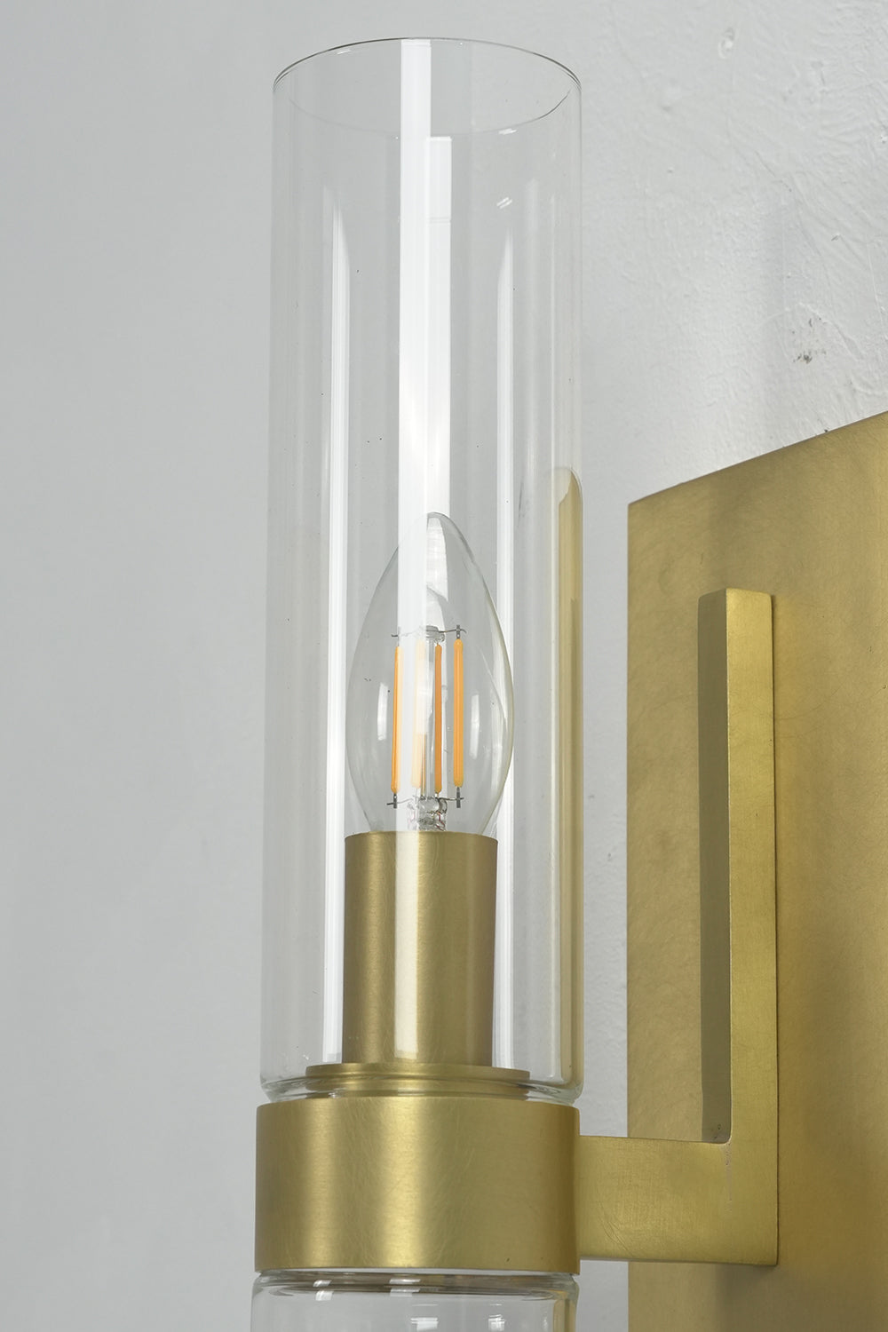 Detailed view of clear glass cylinder and bulb | Brass, Glass | Focus on the transparent material and light source | vexa lamps