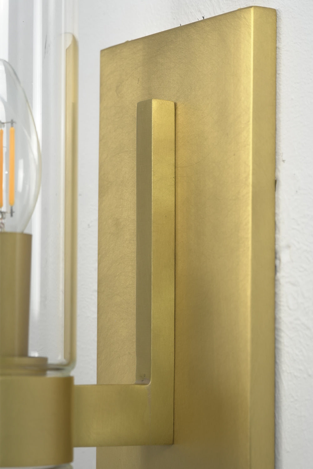 Side bracket and backplate detail | Brass | Close-up showing the metallic texture and installation point | vexa lamps