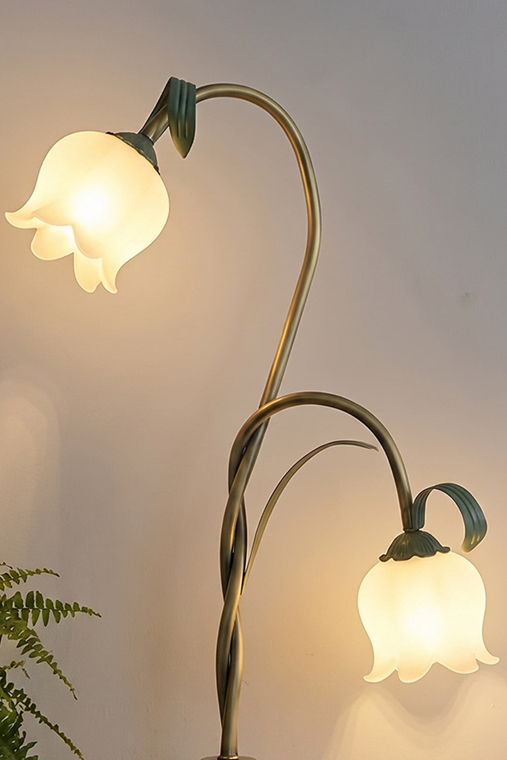 Linnea Tulip Bloom Floor Lamp | Glass and Green Metal | Medium close-up highlighting illuminated flower shades on intertwined green branches | vexa lamps
