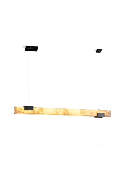 Liora Linear Alabaster Pendant Light | Natural Alabaster and Black Metal | Glowing softly against a pure white background showcasing its sleek block linear design | vexa lamps