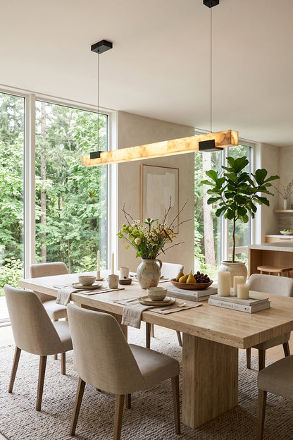 Liora Linear Alabaster Pendant Light | Natural Alabaster and Black Metal | Styled in a bright modern dining room above a long wooden table with beige fabric chairs | vexa lamps