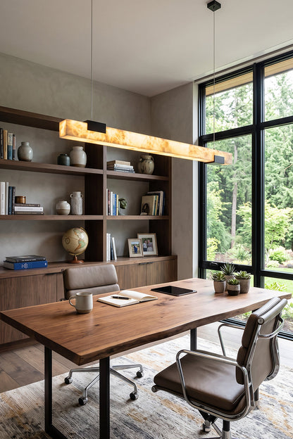 Liora Linear Alabaster Pendant Light | Natural Alabaster and Black Metal | Hanging above a long wooden desk with an office chair in a bright contemporary study room | vexa lamps