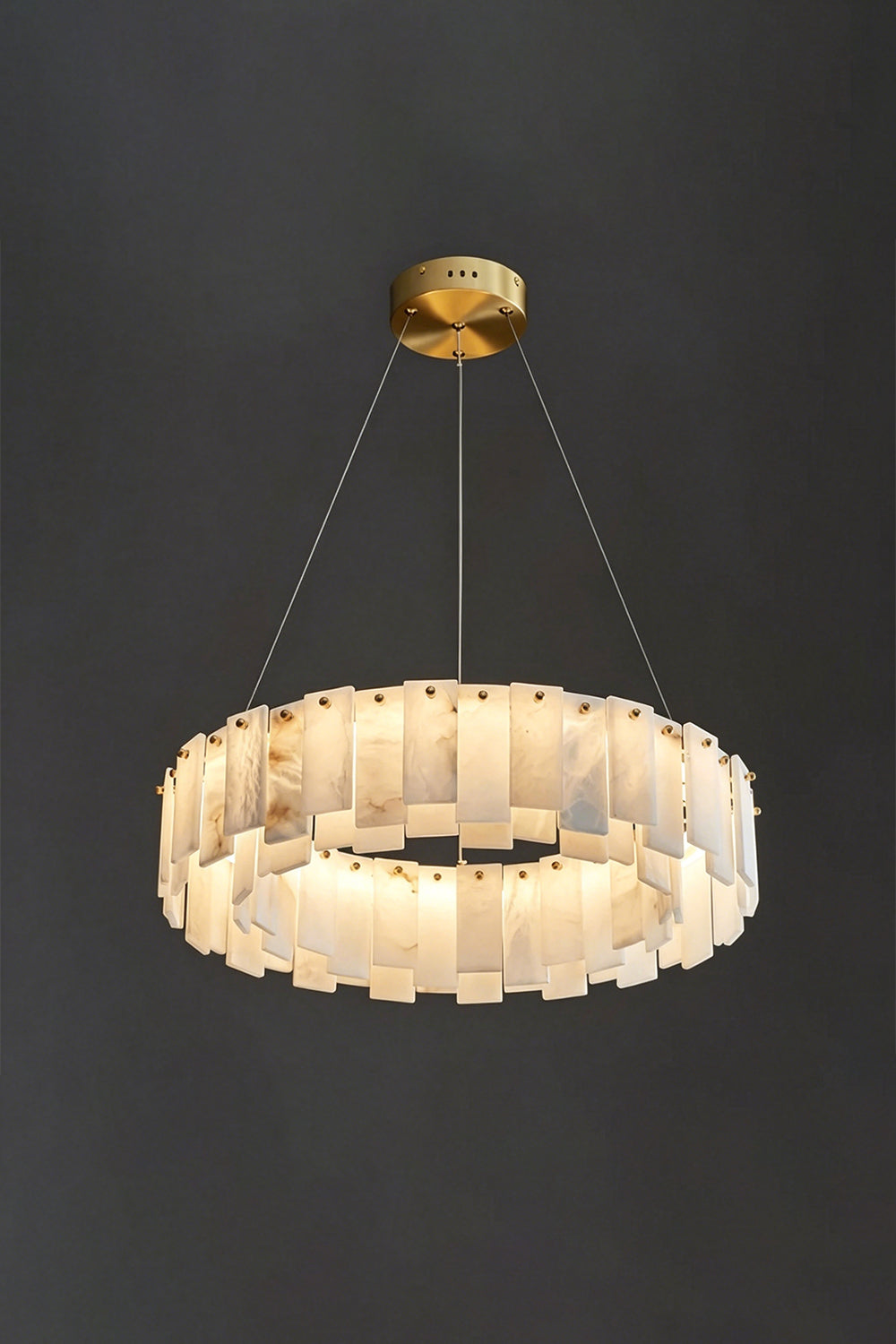 Luminous Alabaster Halcyon Chandelier | Alabaster, Brass | Lit single-tier chandelier on dark grey background | vexa lamps