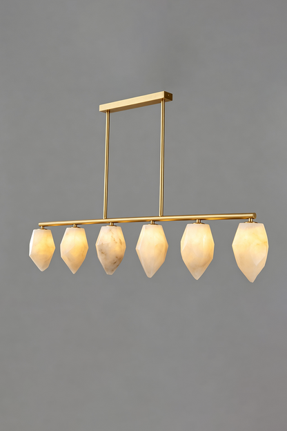 Manon Alabaster Drop Linear Chandelier | Natural Alabaster and Brass | Full front view glowing softly against a solid grey background | vexa lamps