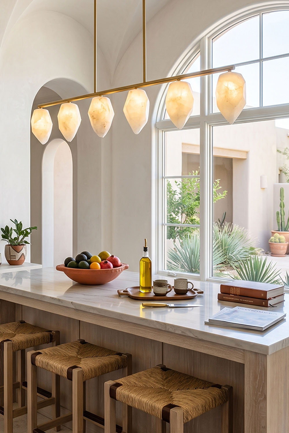 Manon Alabaster Drop Linear Chandelier | Natural Alabaster and Brass | Suspended over a modern kitchen island with wooden bar stools | vexa lamps