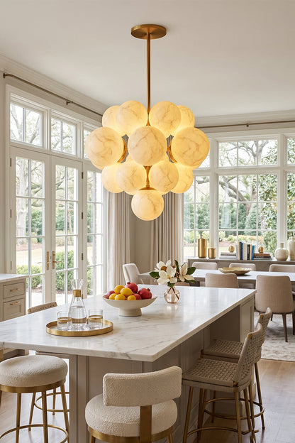 Marcella Alabaster Grape Cluster Chandelier illuminating a modern kitchen with elegant design.
