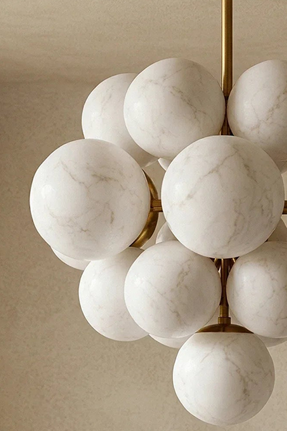 Marcella Alabaster Grape Cluster Chandelier featuring hand-carved alabaster spheres in a stylish arrangement.