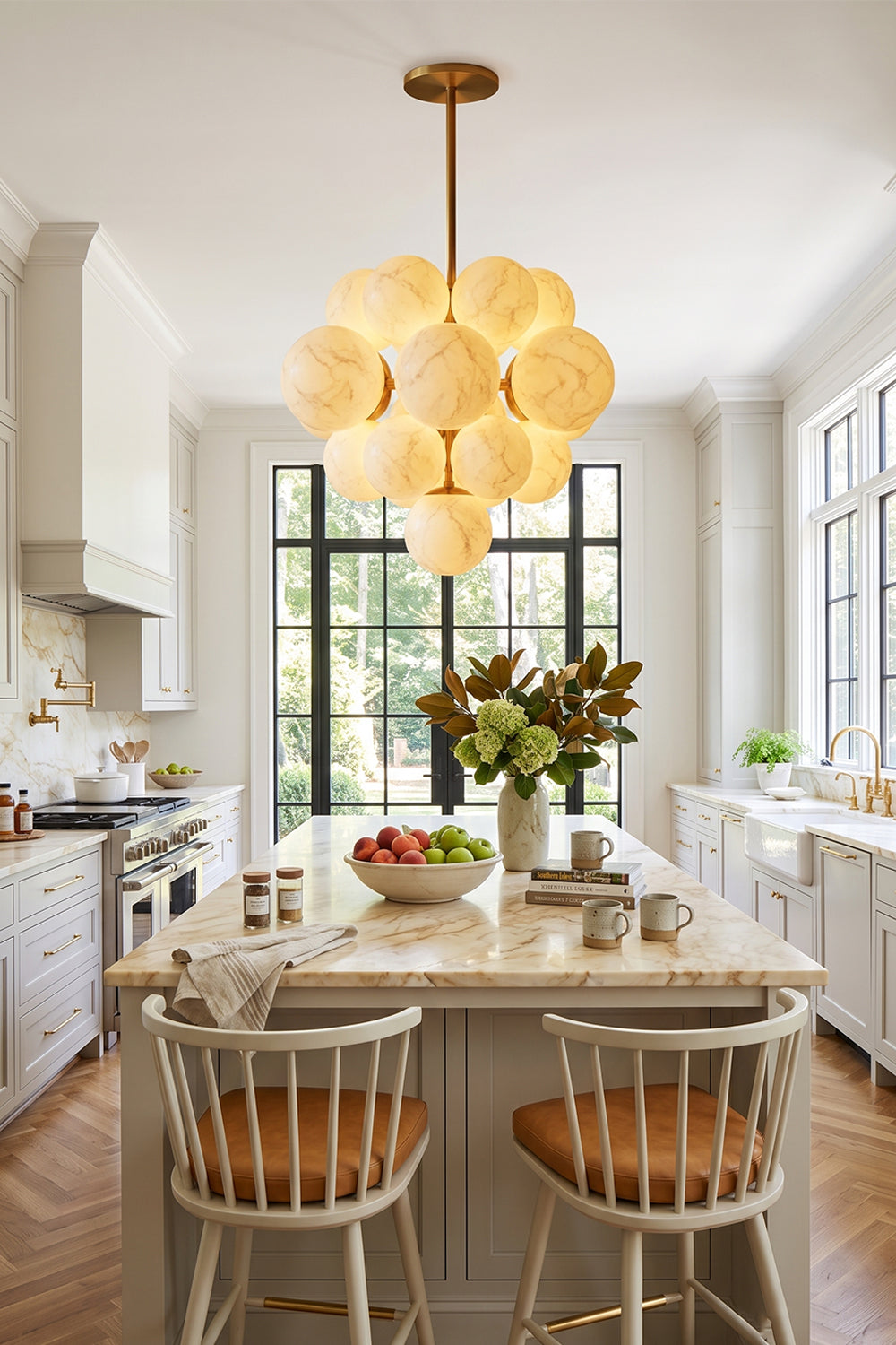 Marcella Alabaster Grape Cluster Chandelier illuminating a modern kitchen with warm, organic elegance.