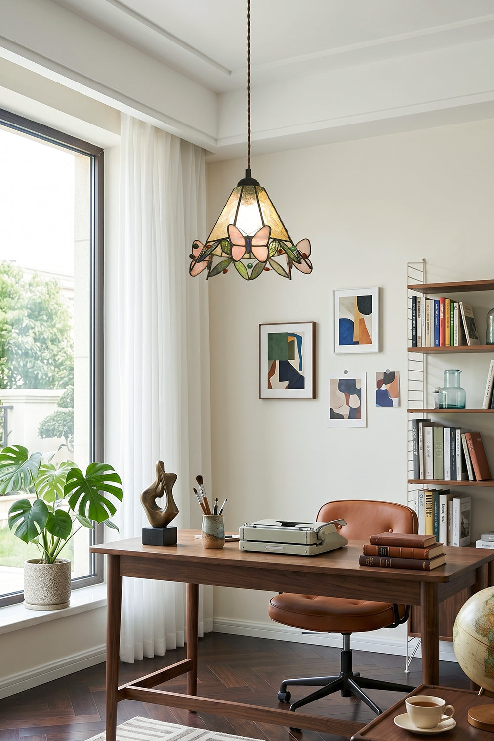 Mariposa Canopy Stained Glass Pendant Lamp | Glass, Metal | Installed in a cozy home office workspace above a wooden writing desk and leather chair | vexa lamps