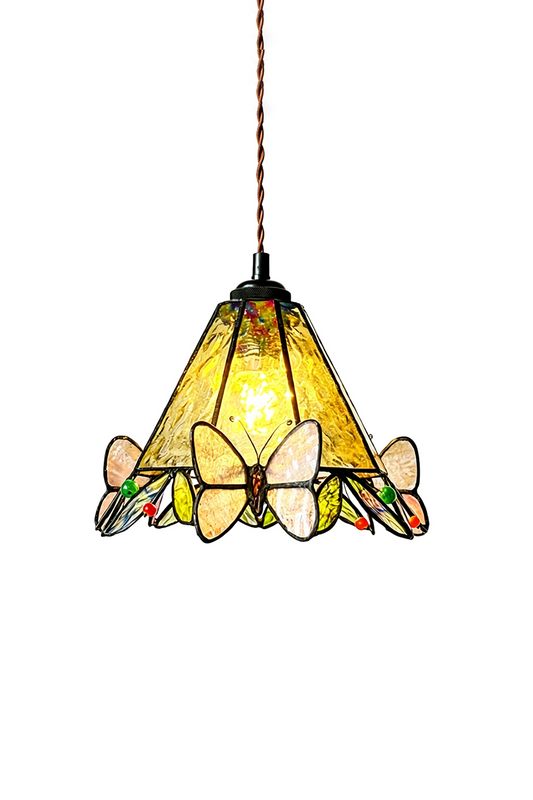 Mariposa Canopy Stained Glass Pendant Lamp | Glass, Metal | Fully lit Tiffany-style conical stained glass pendant light with yellow textured panels and pink butterfly accents hanging from a twisted brown cord | Isolated lit product shot on white background | vexa lamps