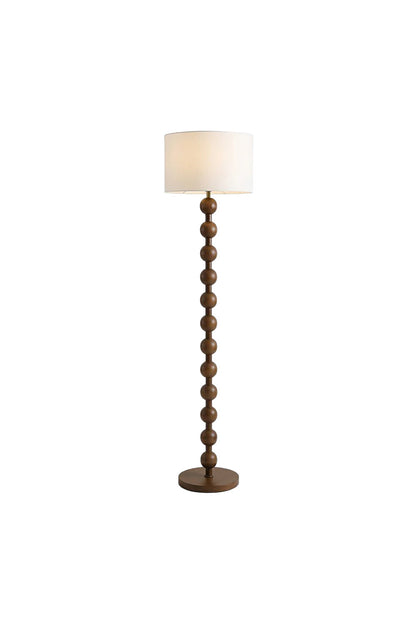 Marlow Stacked Wood Floor Lamp | Wood, Fabric | Isolated view of a traditional standing floor lamp featuring a dark walnut stacked spherical bobbin wood base and a classic white drum shade | White background | vexa lamps