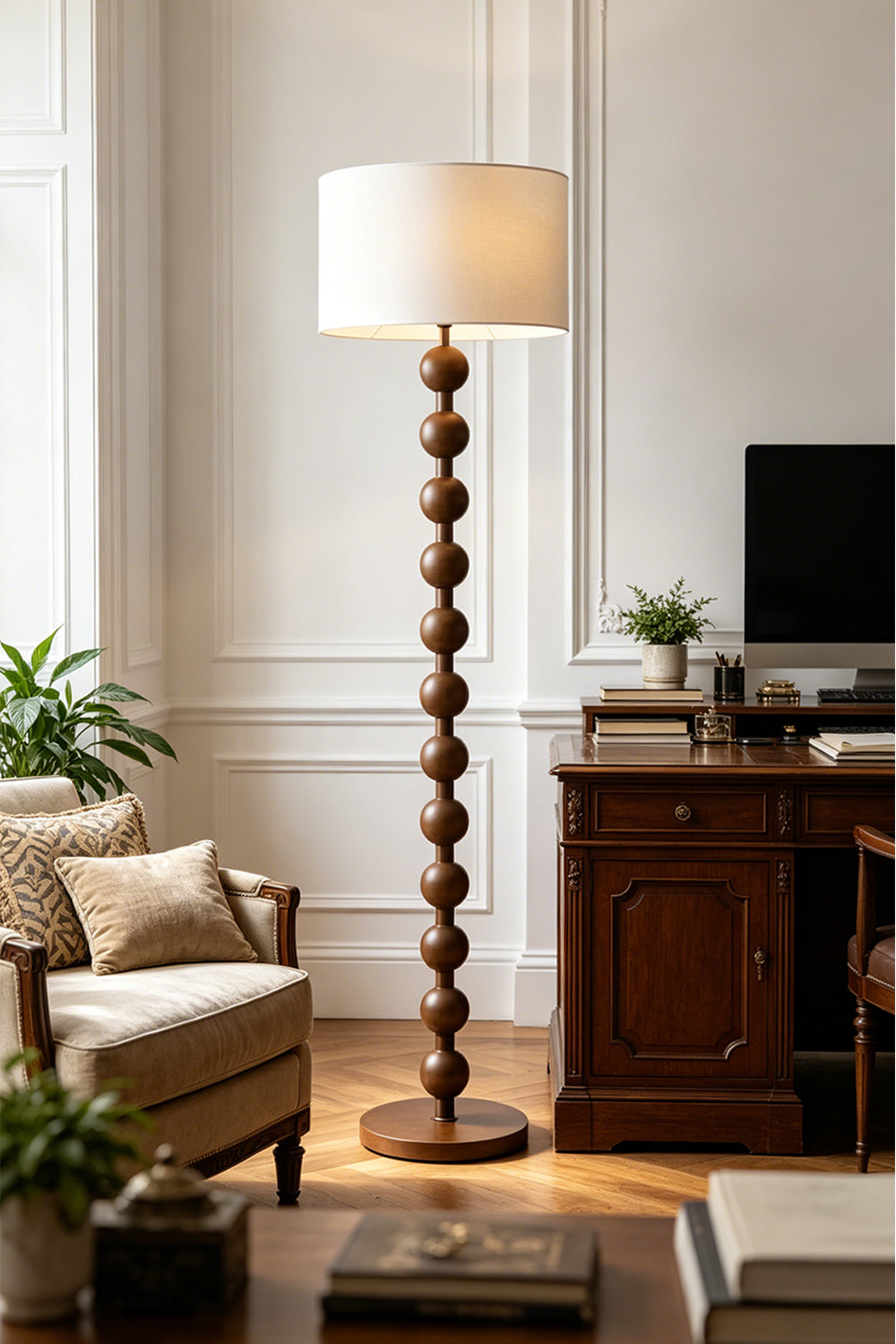 Marlow Stacked Wood Floor Lamp | Wood, Fabric | Positioned as an elegant reading light in a home office or study room near a dark wood desk and upholstered seating | vexa lamps