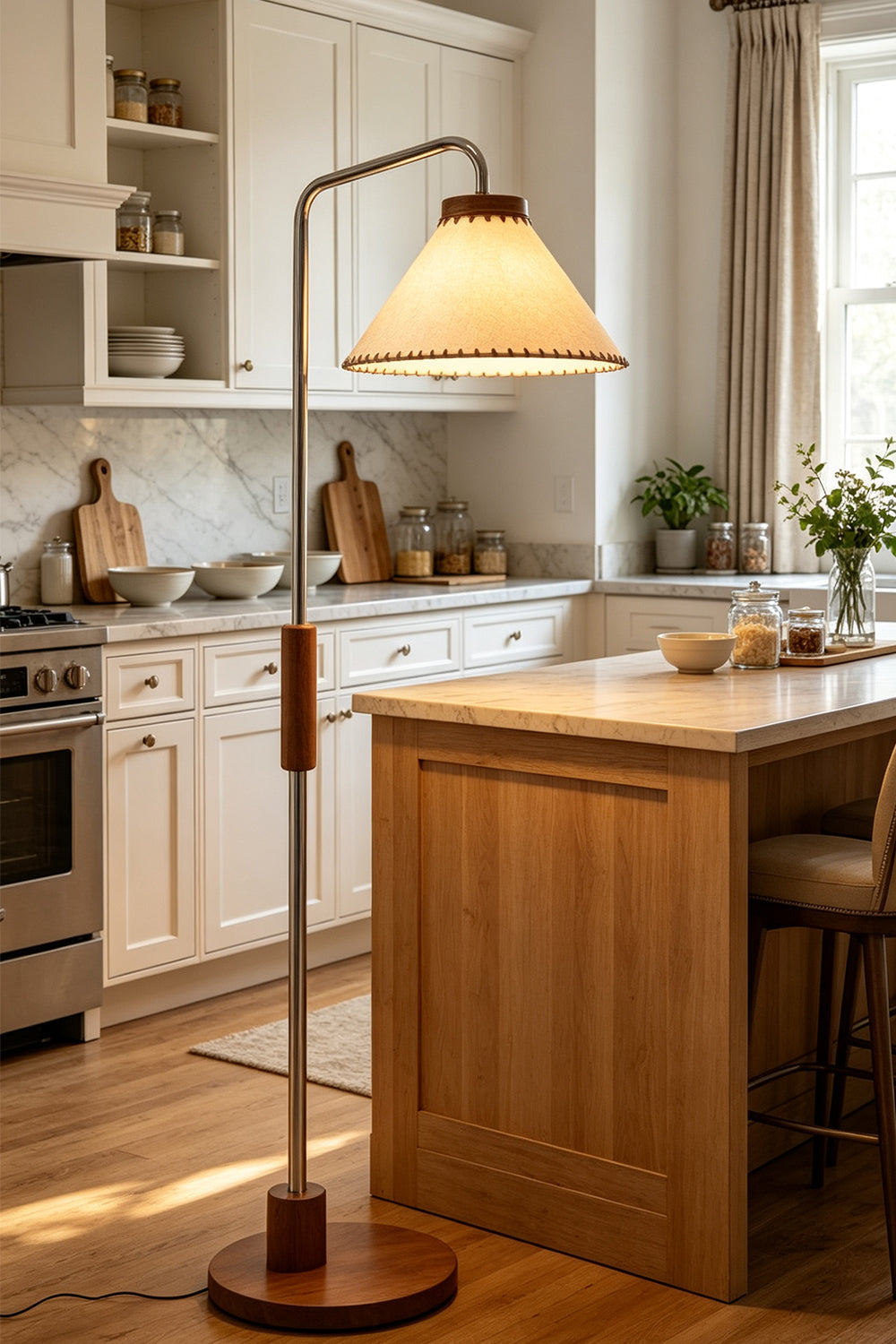 Marlowe Angled Linen Reading Floor Lamp | Linen, Wood, and Chrome Metal | Positioned in a modern kitchen area next to a large wooden island counter and white cabinets | vexa lamps