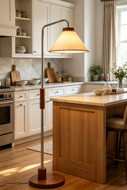 Marlowe Angled Linen Reading Floor Lamp | Linen, Wood, and Chrome Metal | Positioned in a modern kitchen area next to a large wooden island counter and white cabinets | vexa lamps