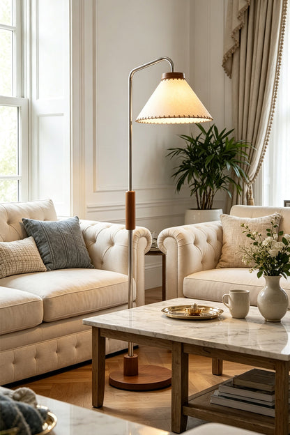 Marlowe Angled Linen Reading Floor Lamp | Linen, Wood, and Chrome Metal | Styled in a brightly lit contemporary living room next to elegant white sofas and a coffee table | vexa lamps