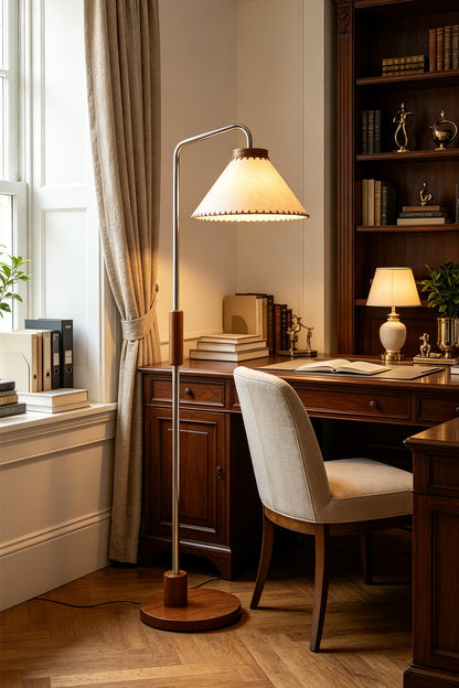 Marlowe Angled Linen Reading Floor Lamp | Linen, Wood, and Chrome Metal | Placed next to a dark wood study desk with a plush white office chair in a traditional home library | vexa lamps