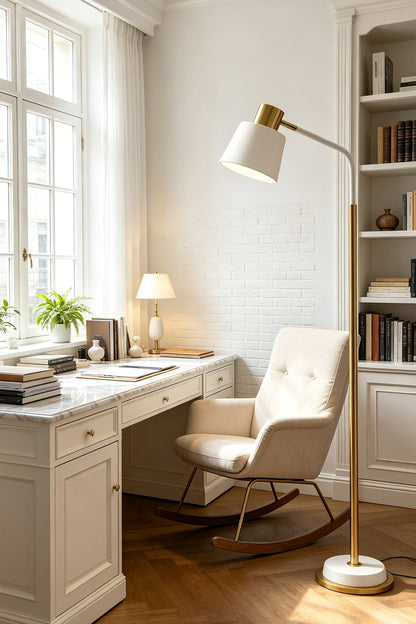 Marlowe Gooseneck Reading Floor Lamp | Matte White and Gold | Standing beside a white armchair in a cozy home library workspace | vexa lamps