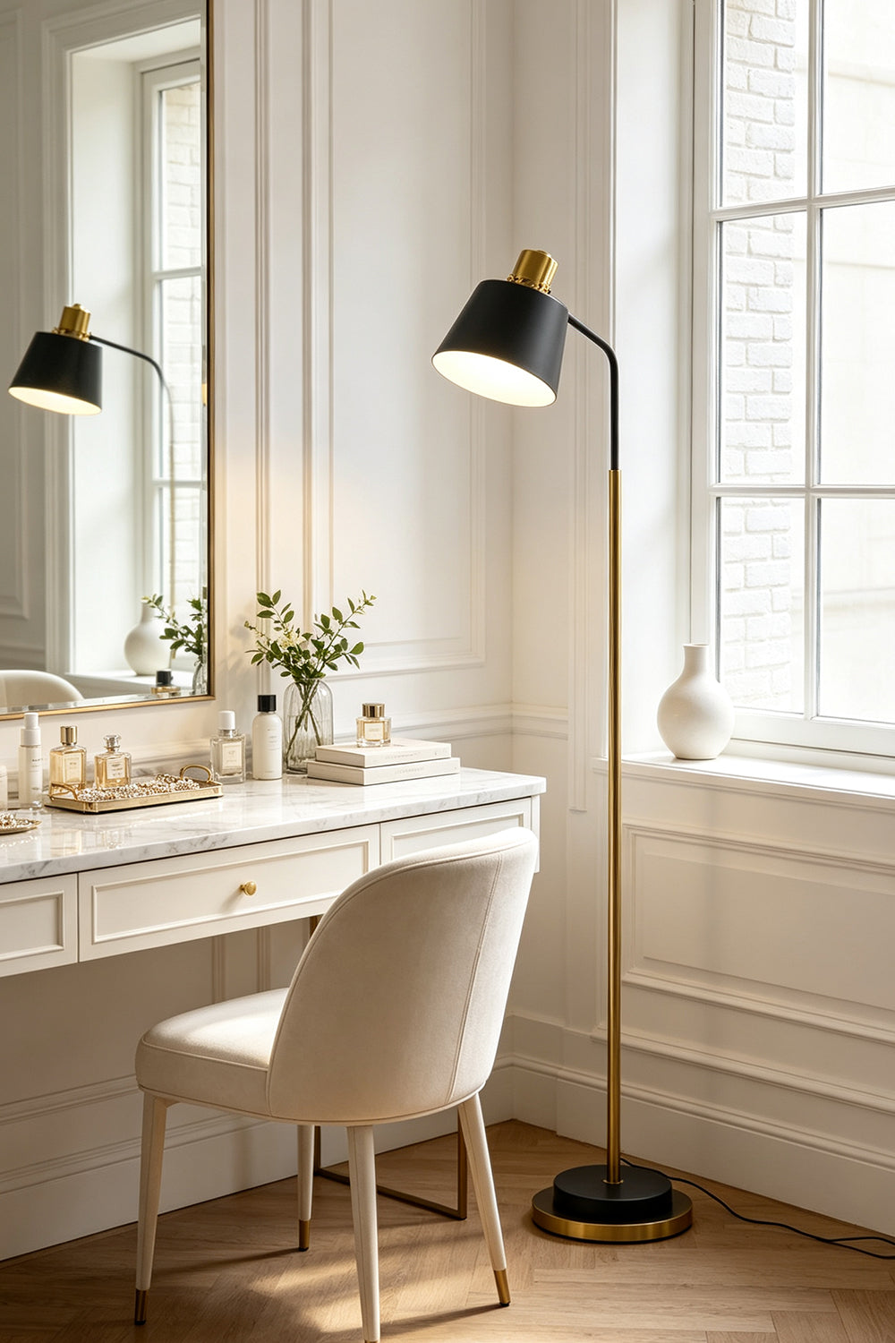 Marlowe Gooseneck Reading Floor Lamp | Matte Black and Brass | Positioned beside an elegant marble vanity table in a bright dressing room | vexa lamps