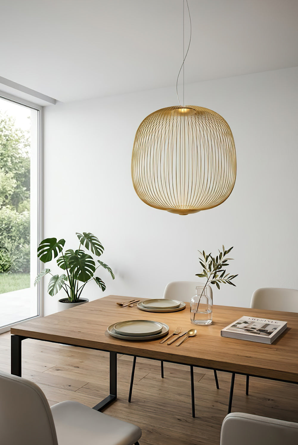 Gold elliptical wire cage light over wooden dining table | Aluminum | Interior dining room scene with natural light | vexa lamps