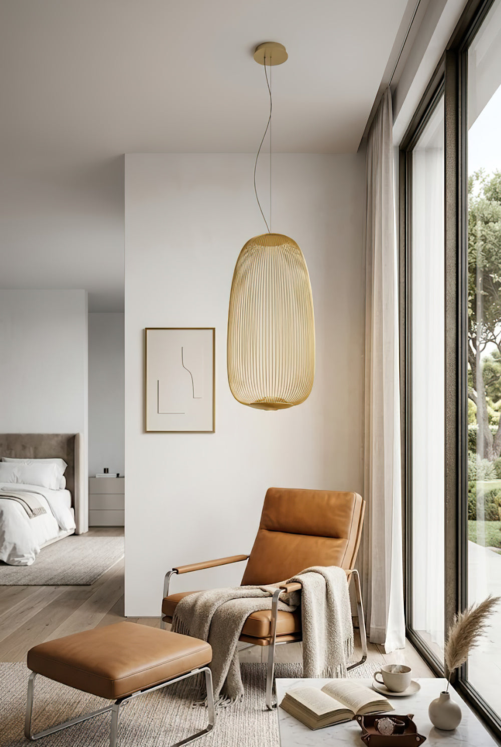 Gold elliptical cage light over leather armchair | Aluminum | Modern bedroom or living room corner | vexa lamps