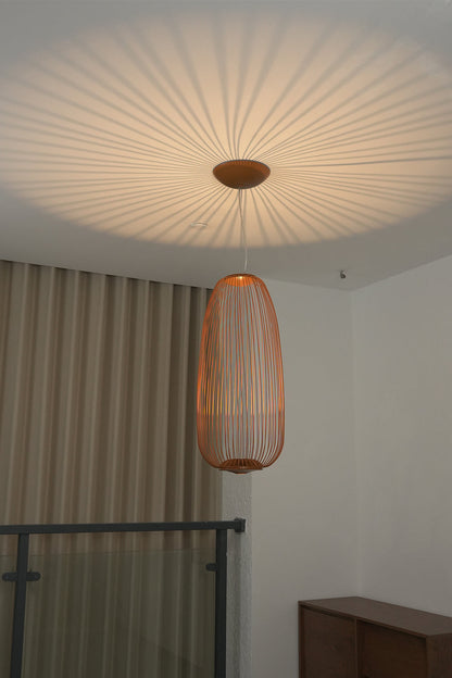 Lit copper wire cage lamp casting radial shadows | Aluminum | Detailed ceiling view showing light patterns | vexa lamps