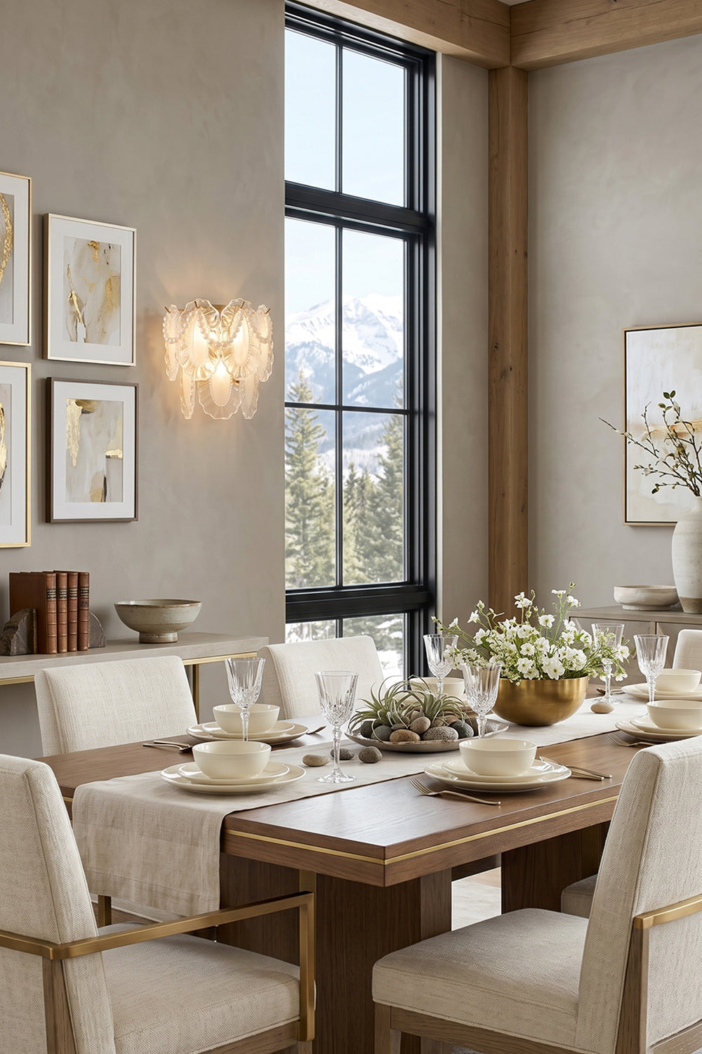 Elegant dining room featuring the Mirella Pearl and Glass Wall Lamp illuminating a beautifully set table.