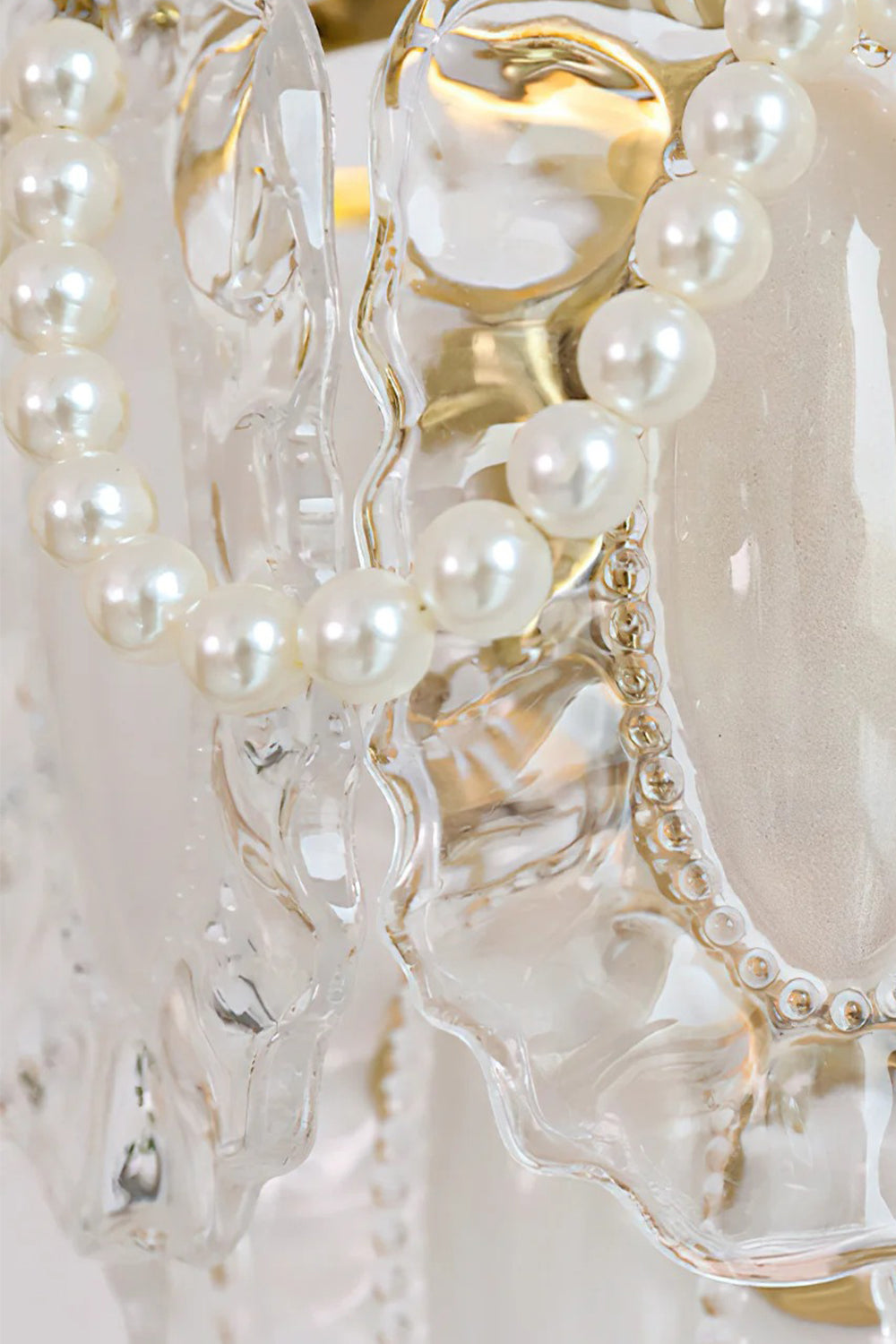 Close-up of the Mirella Pearl and Glass Wall Lamp showcasing textured glass panels and elegant pearl strands.