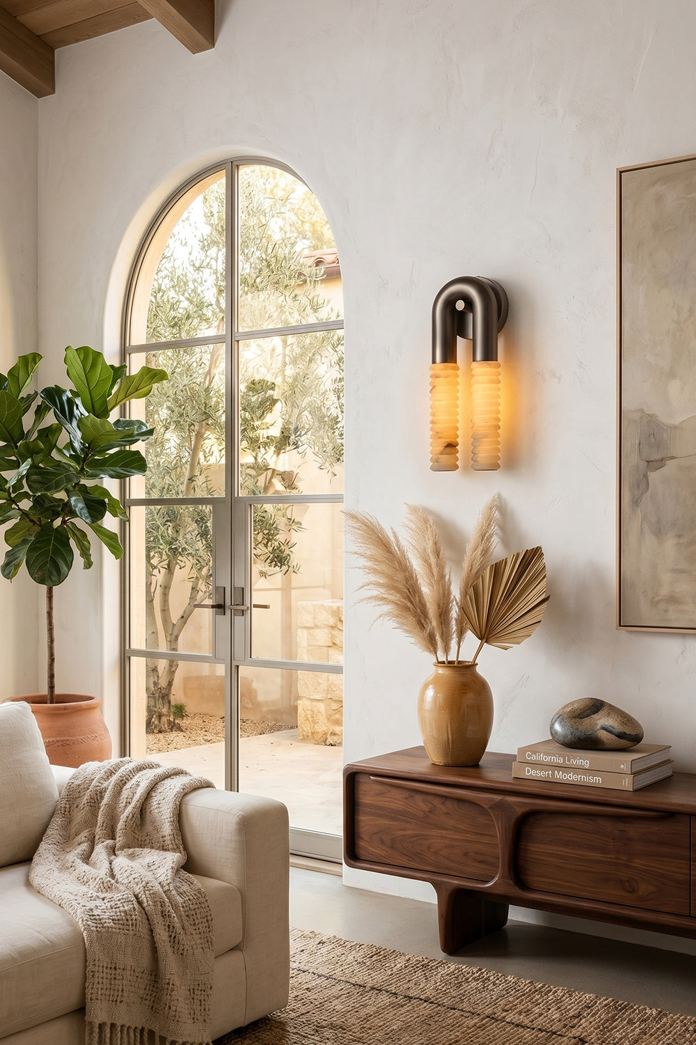 Monolith Arc Alabaster Wall Lamp | Alabaster, Metal | Mounted in a bright entrance with an arched window and rustic wooden console table | vexa lamps