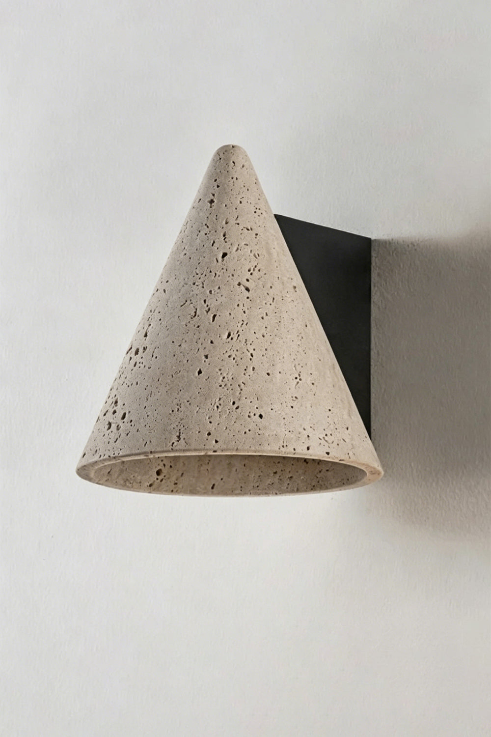 Monolith Cone Travertine Wall Sconce featuring a natural yellow travertine cone design with textured surface.