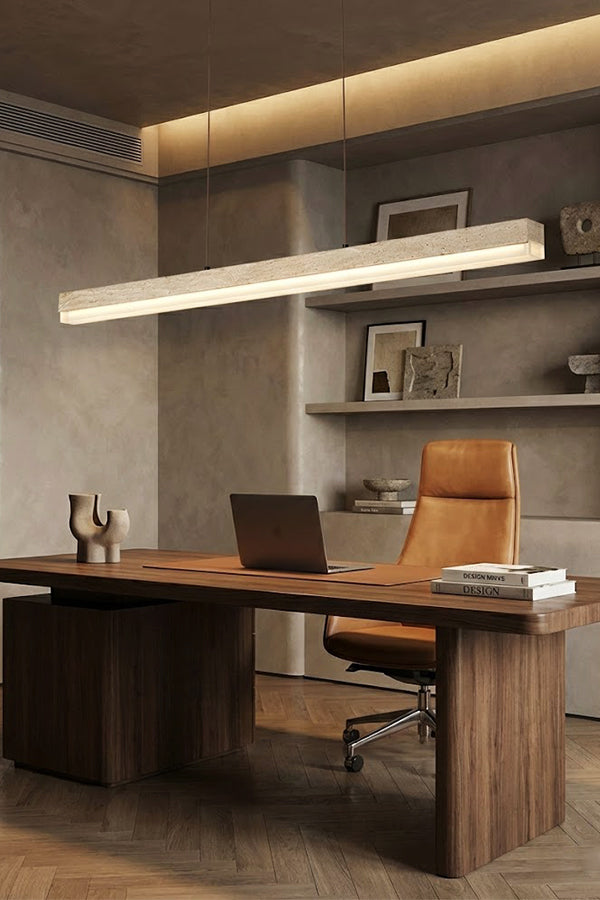 Linear stone pendant light for home office | Travertine, Wood, Acrylic | Installed above a large wooden desk and leather chair | vexa lamps