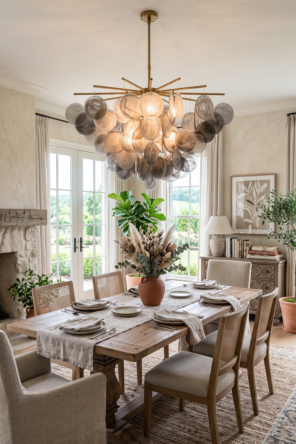 Nimbus Smoked Glass Disc Chandelier illuminating a modern dining room with elegant decor.