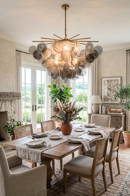 Nimbus Smoked Glass Disc Chandelier illuminating a modern dining room with elegant decor.