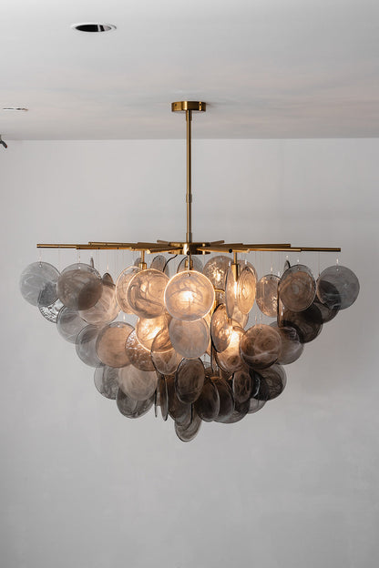 Nimbus Smoked Glass Disc Chandelier featuring hand-blown glass discs cascading softly with warm light.