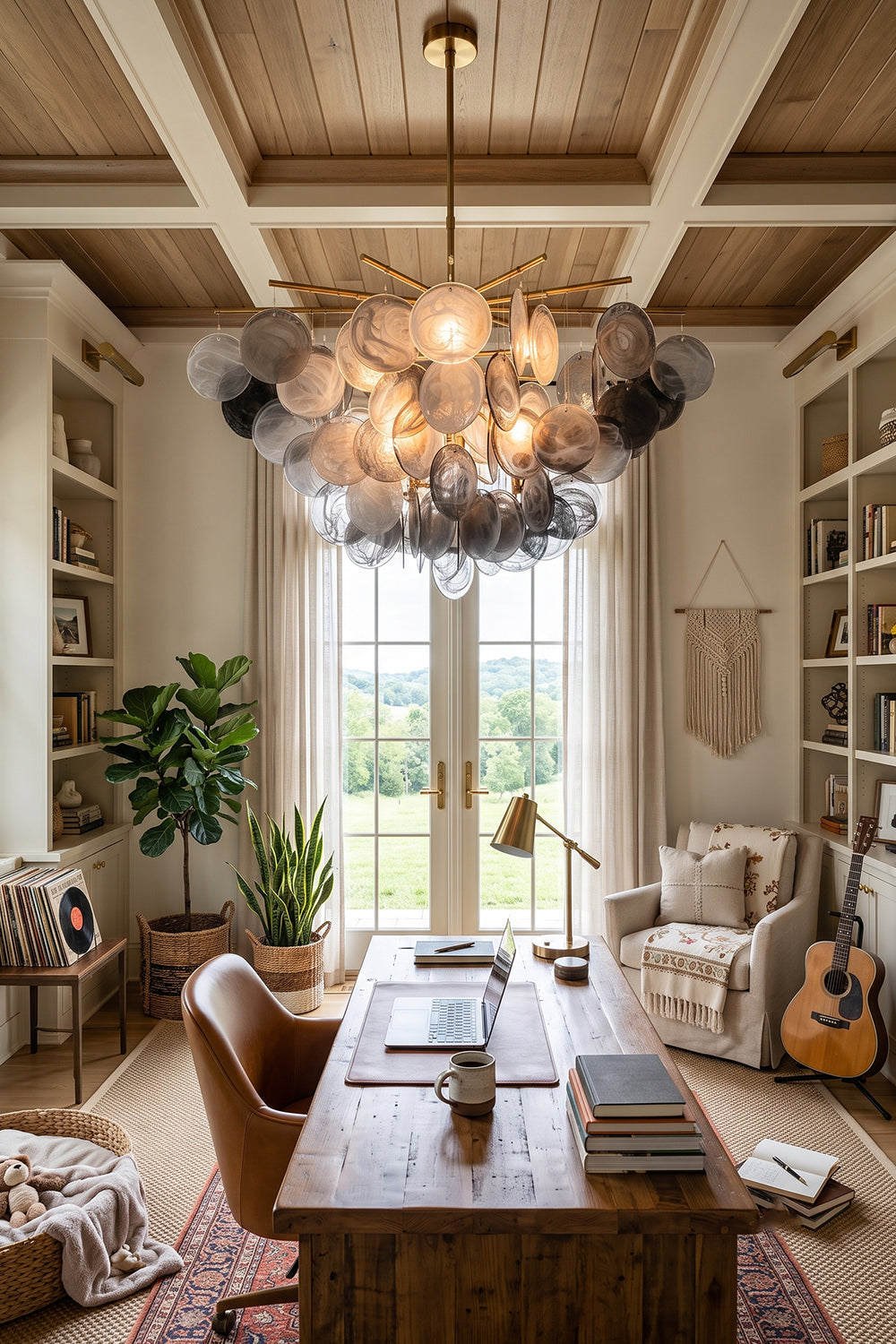 Nimbus Smoked Glass Disc Chandelier illuminating a modern home office with warm light and elegant decor.
