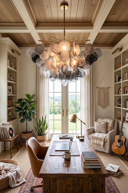 Nimbus Smoked Glass Disc Chandelier illuminating a modern home office with warm light and elegant decor.