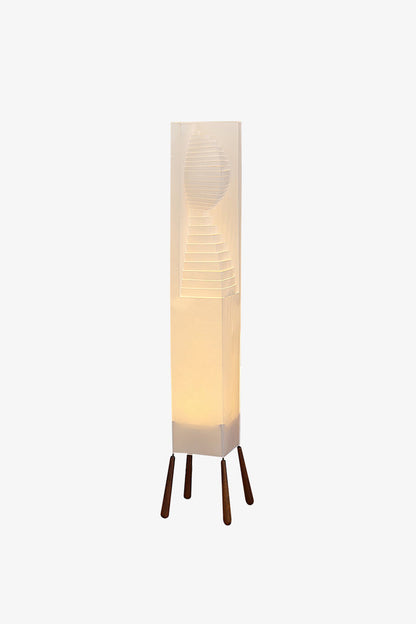 Nori Sculptural Leaf Floor Lamp | Fabric, Wood | Illuminated front studio view of the wavy column floor light projecting a warm comforting glow | vexa lamps